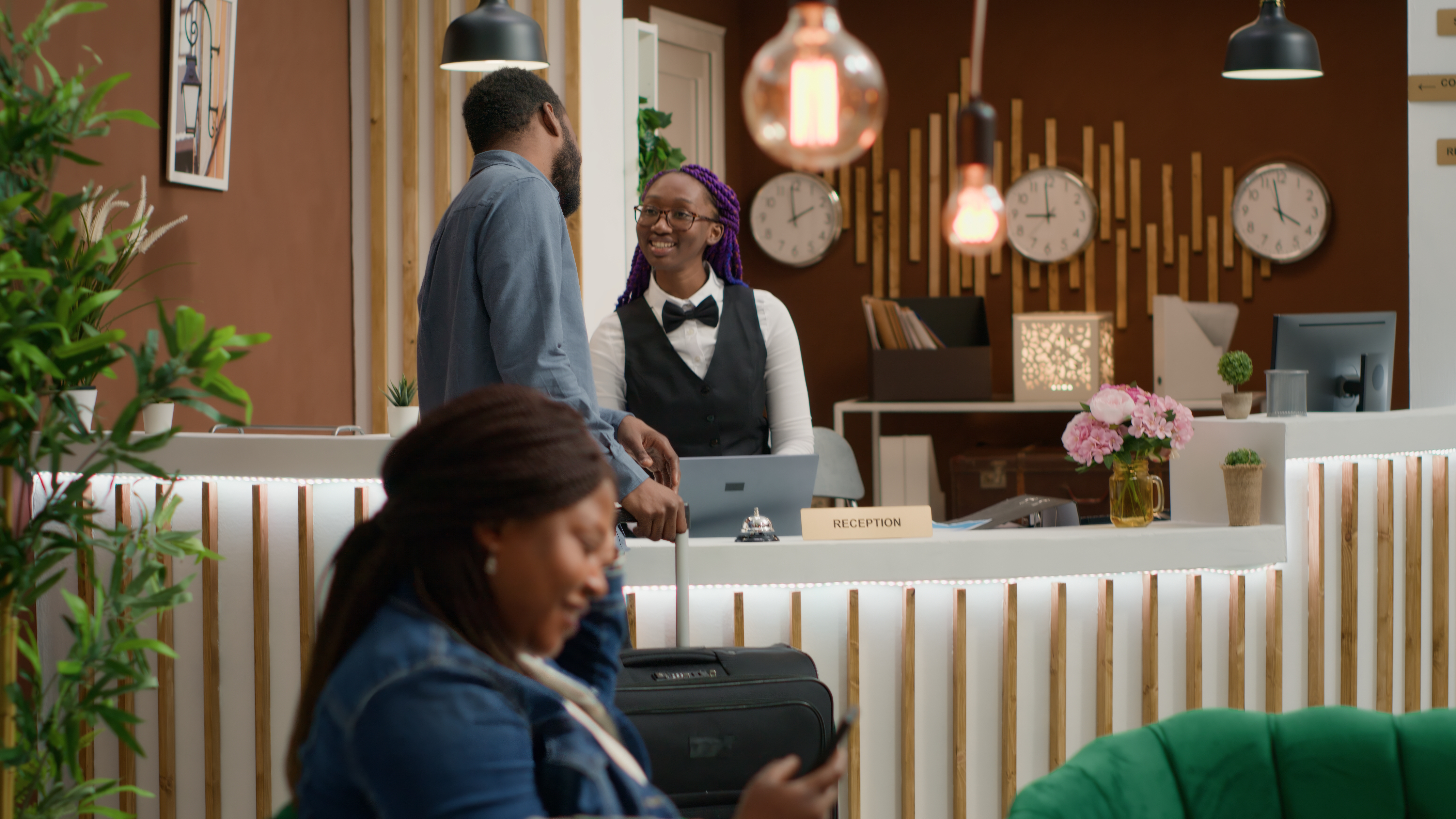 Front-desk professional welcoming guests